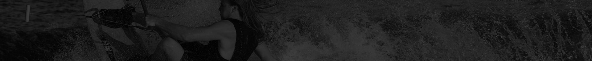 person wakeboarding behind boat